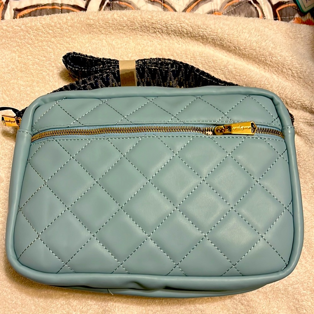 Light blue cross body, never used urban original vegan leather